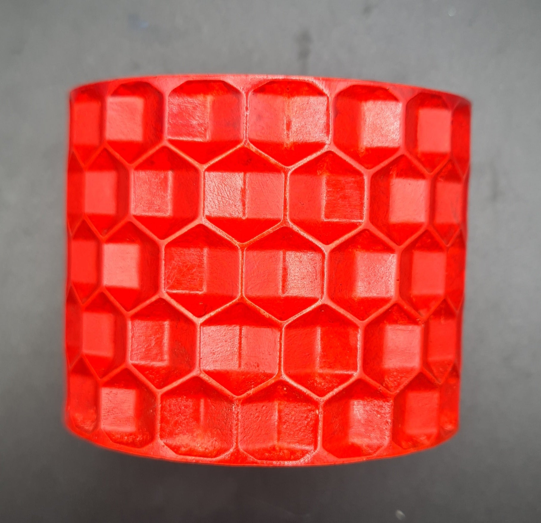 red Unique honeycomb design candle, blending style with the sweetness of bees.