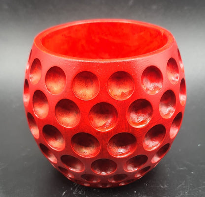 red Elegant bubble-pot candle, a visual treat with an inviting fragrance.