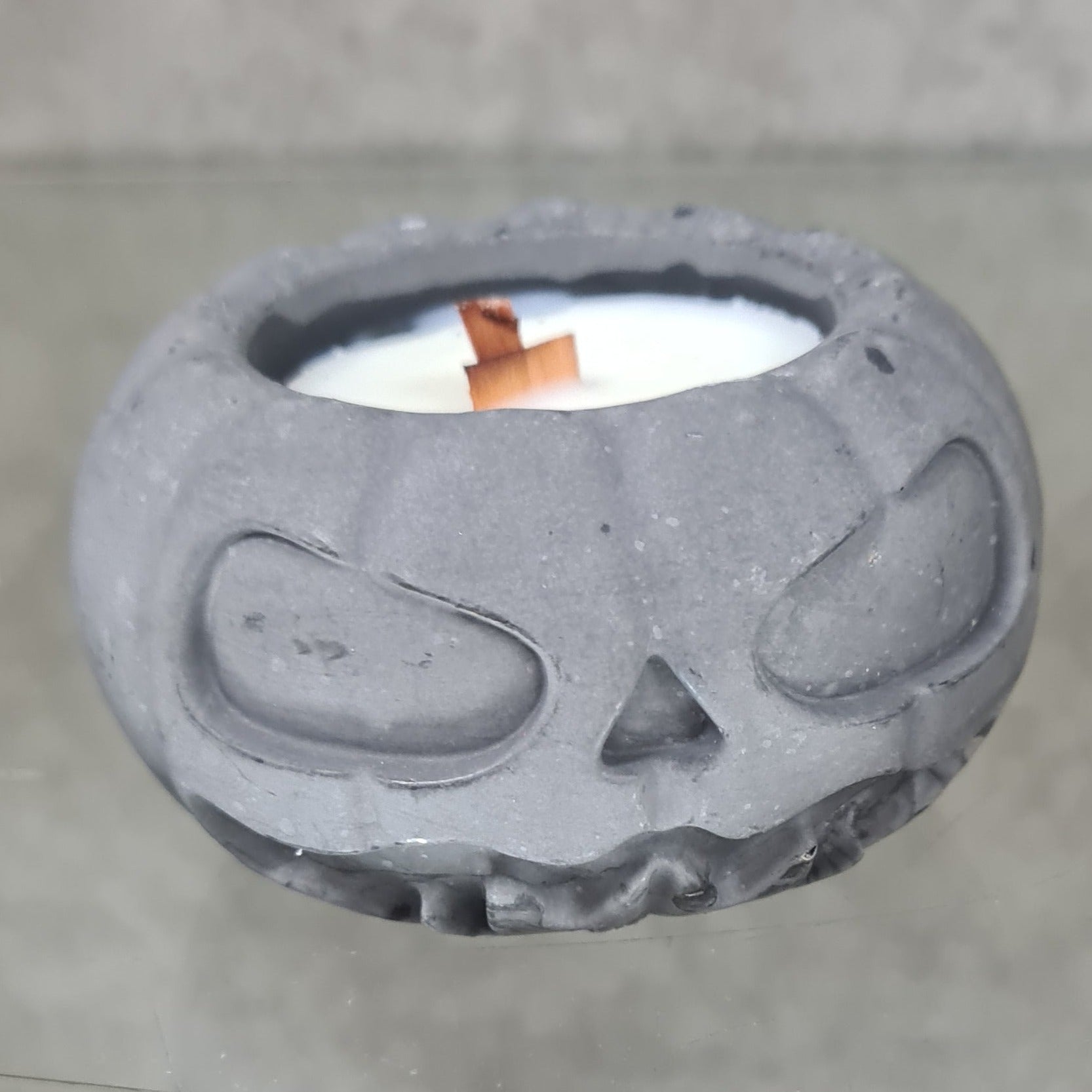 Harvest Bliss Scented Pumpkin Candle with enchanting autumn aroma, eco-friendly natural wax, and festive Halloween design.