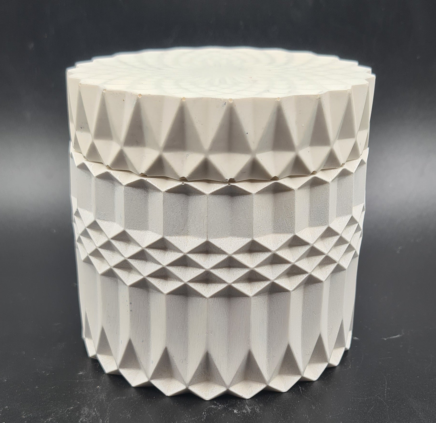 Artisanal craftsmanship meets geometry in this unique candle pot.
